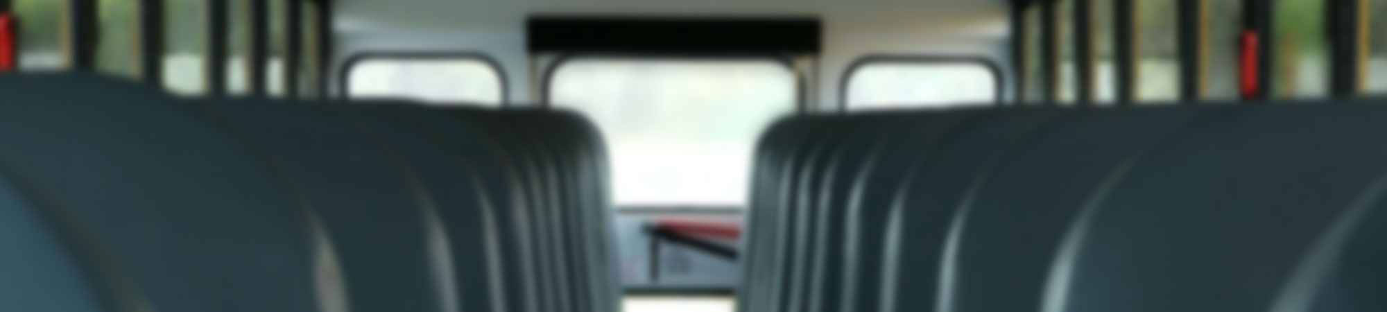 Main aisle and rows of seats in an old school bus